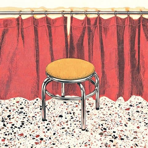 A cozy vintage booth ready for a photo strip