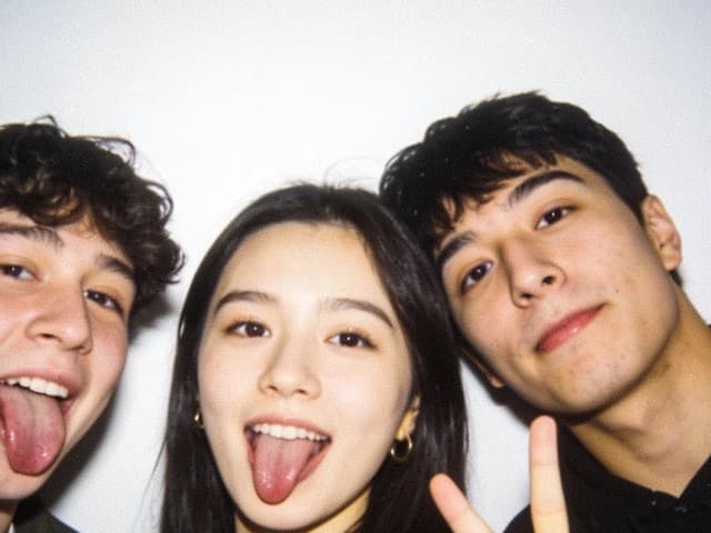 The same four friends pulling silly poses